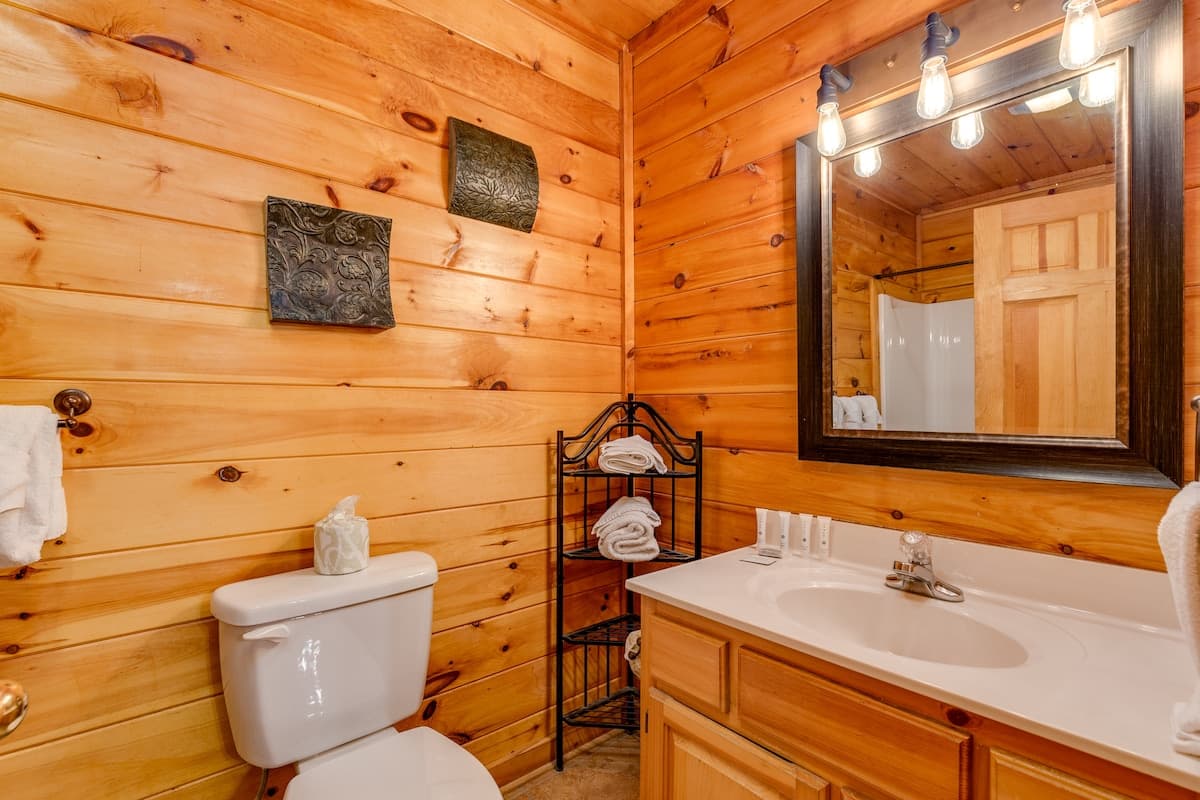 Bathroom with vanity, mirror, and clean towels