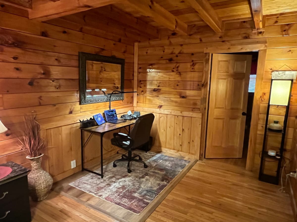 Cabin workspace with a dedicated desk, office chair, and fast WiFi