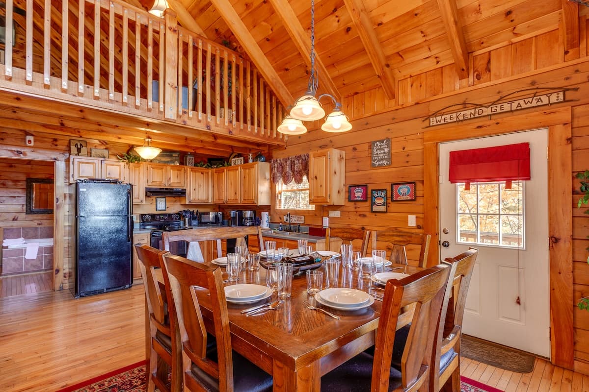 Bathroom vanity and shower area with pine paneling