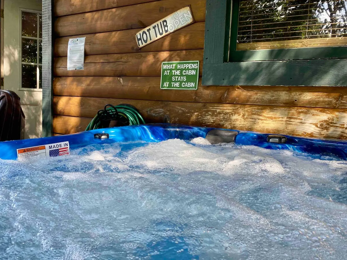 Actual photo of the 56-jet hot tub and mountain views at Thistle Britches