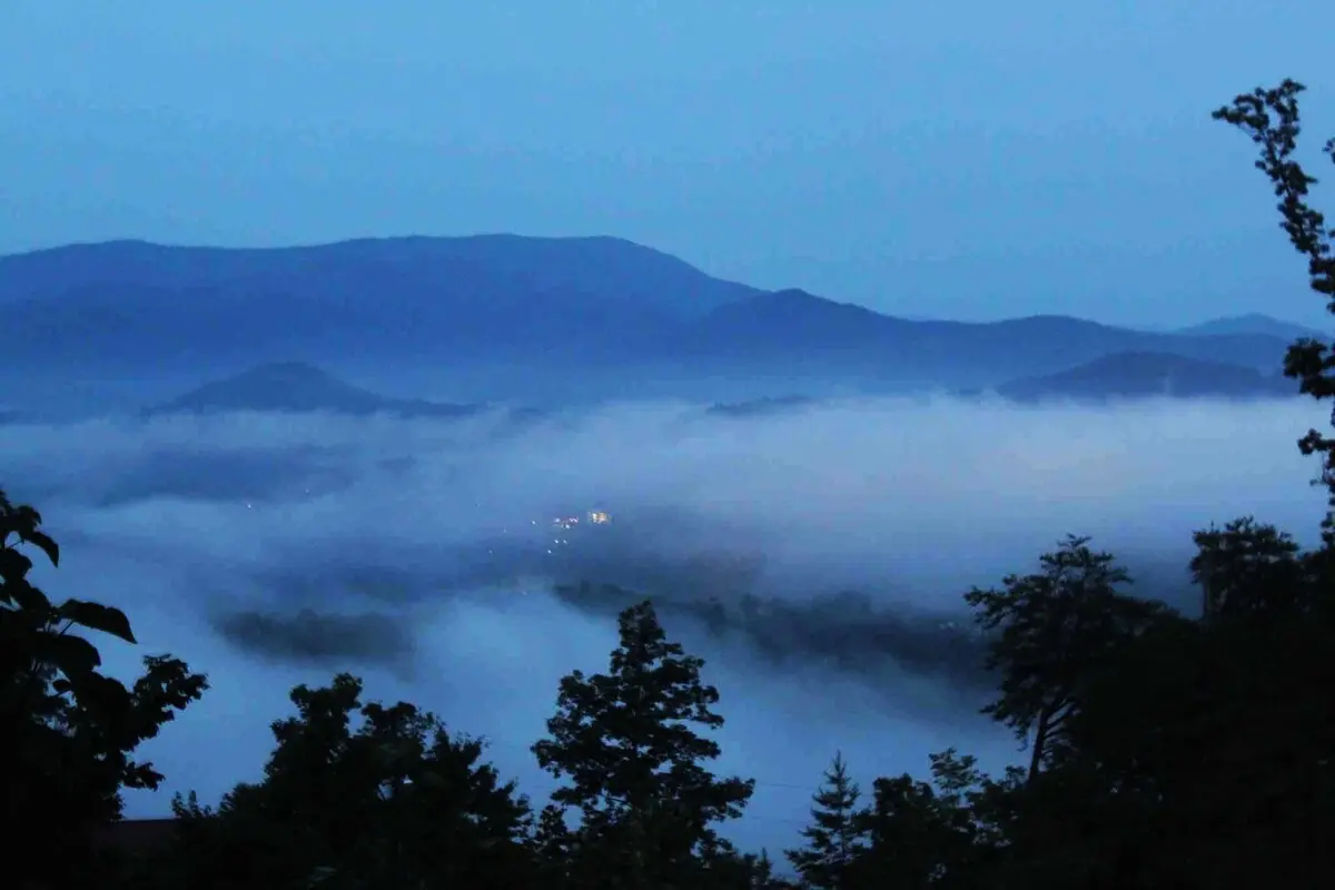 Actual misty morning view from the Thistle Britches deck of the Smoky Mountains